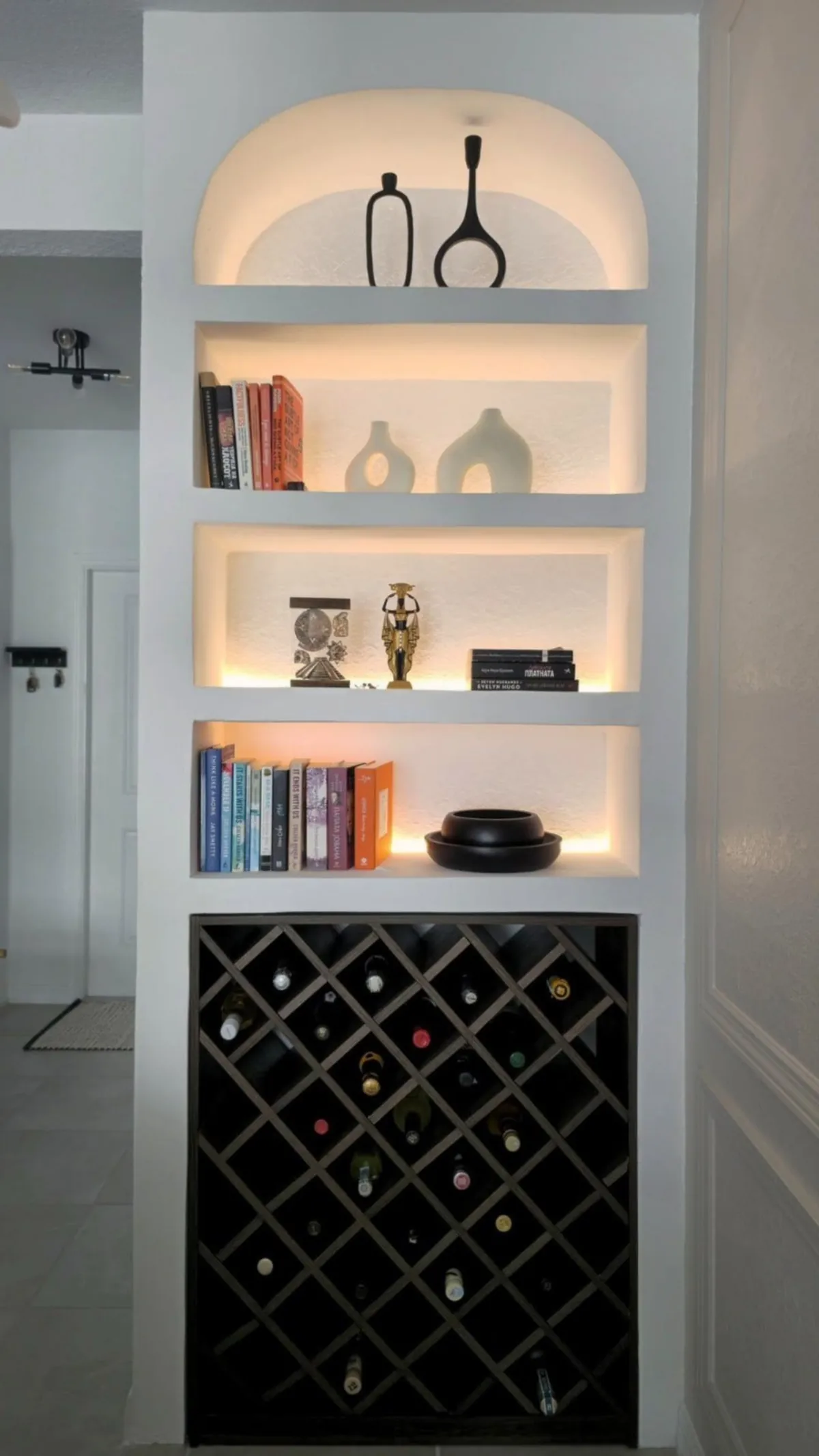 Custom built-in bookshelf and wine rack niche with LED accent lighting, Bradenton FL
