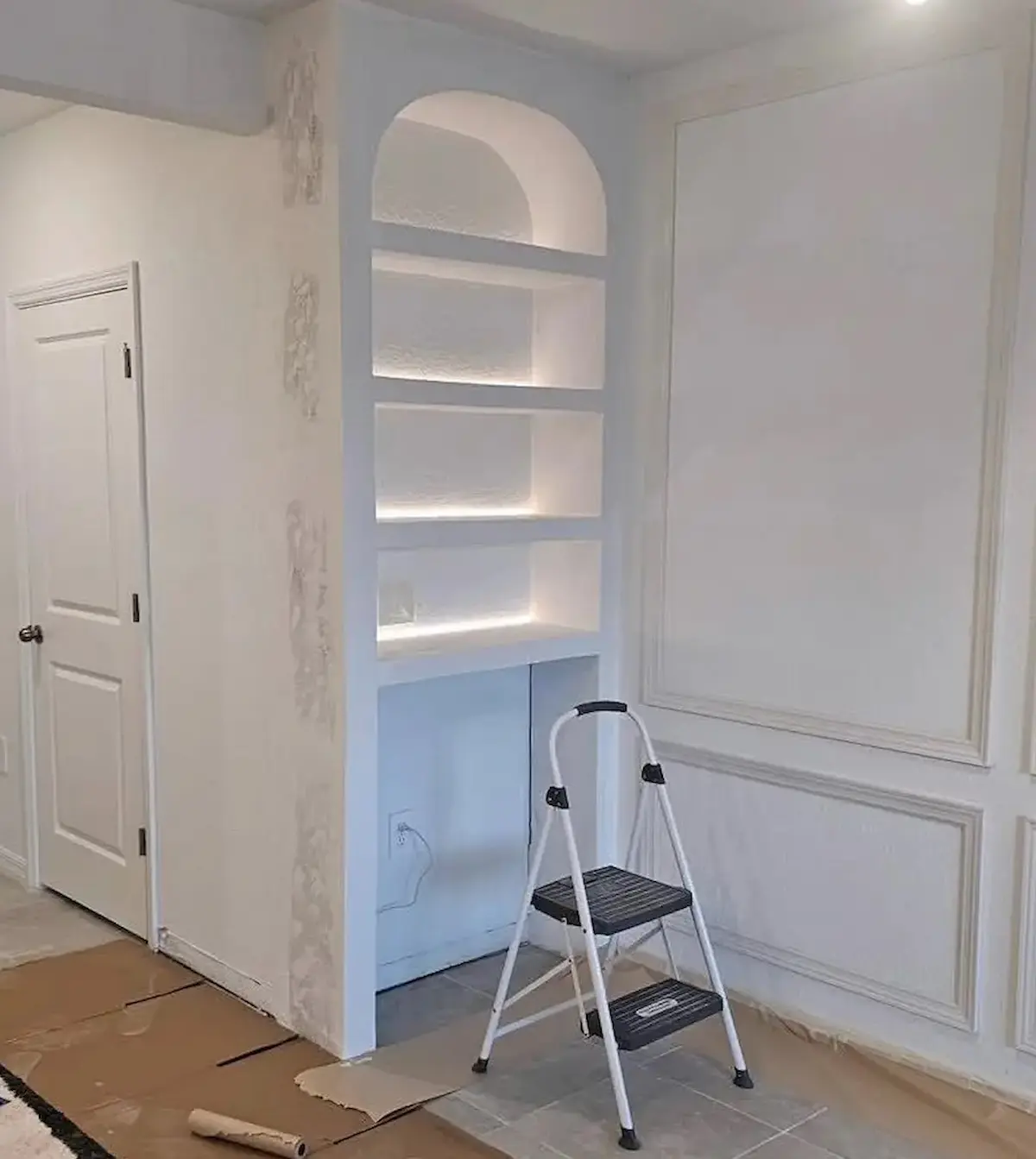 Custom wine wall during drywall finishing and preparation for paint
