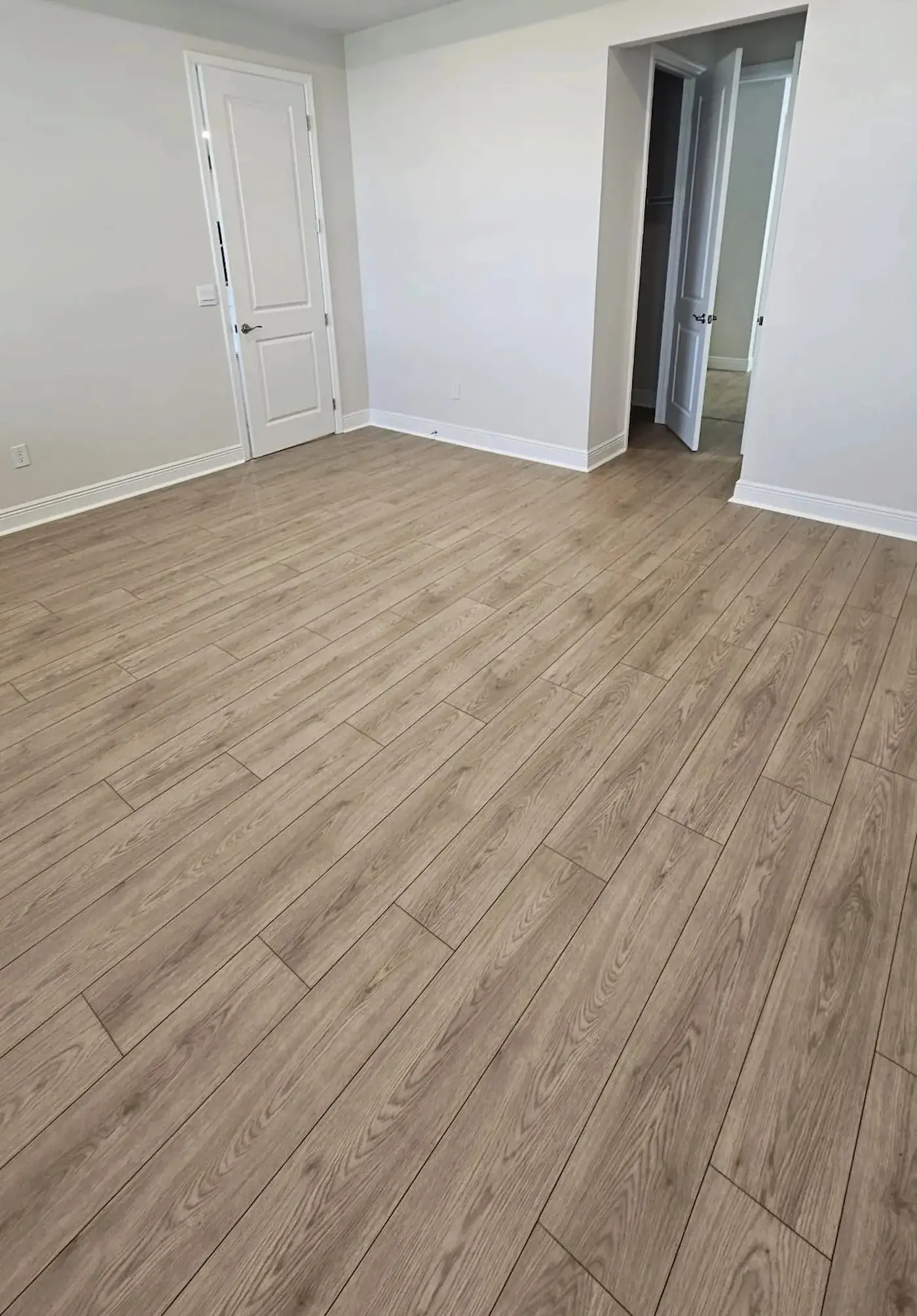 Wide view of a completed luxury flooring installation showcasing seamless transitions, clean lines, and premium craftsmanship in Sarasota, Florida