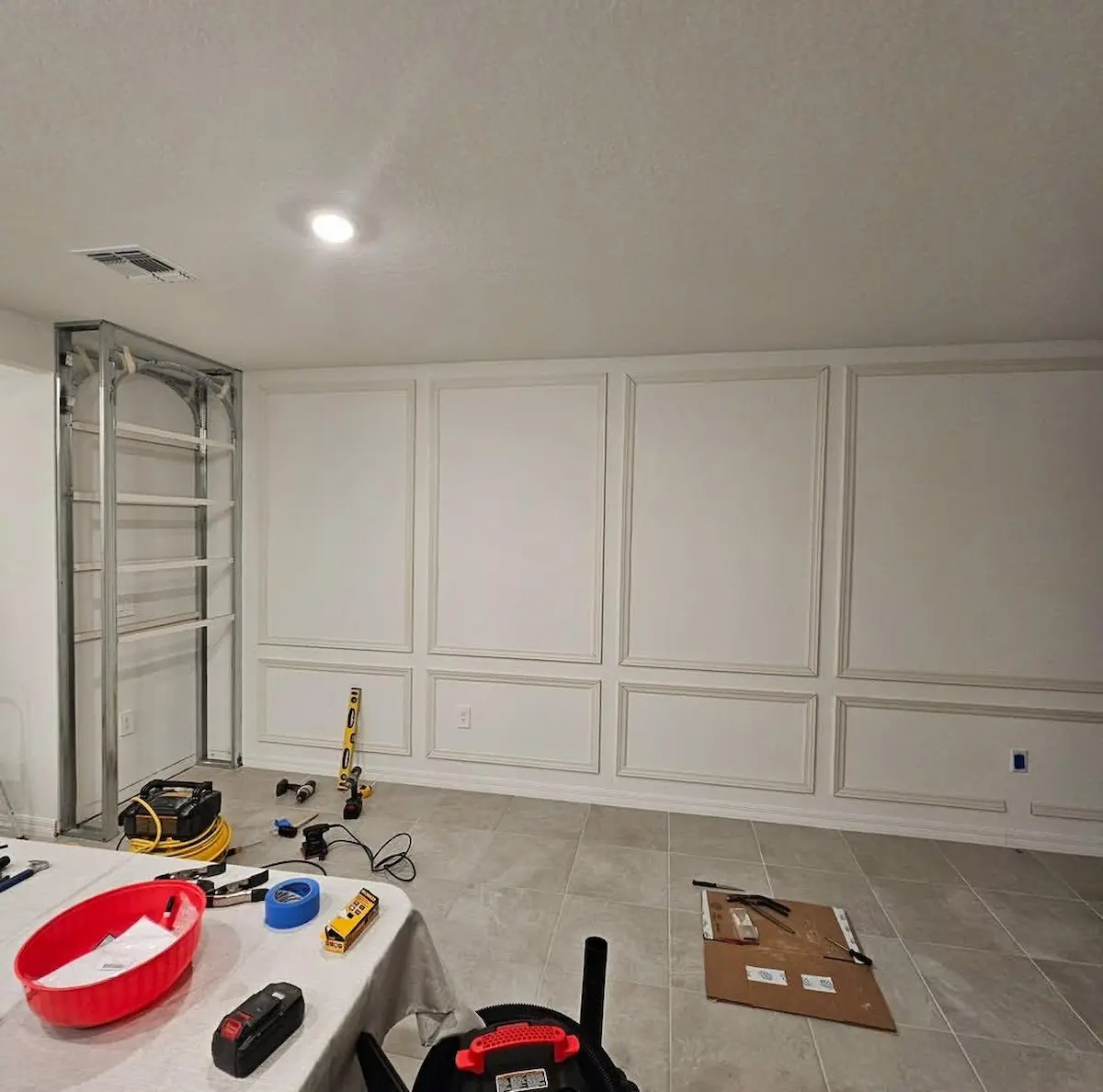 Framing and layout work during a complete living room interior update project