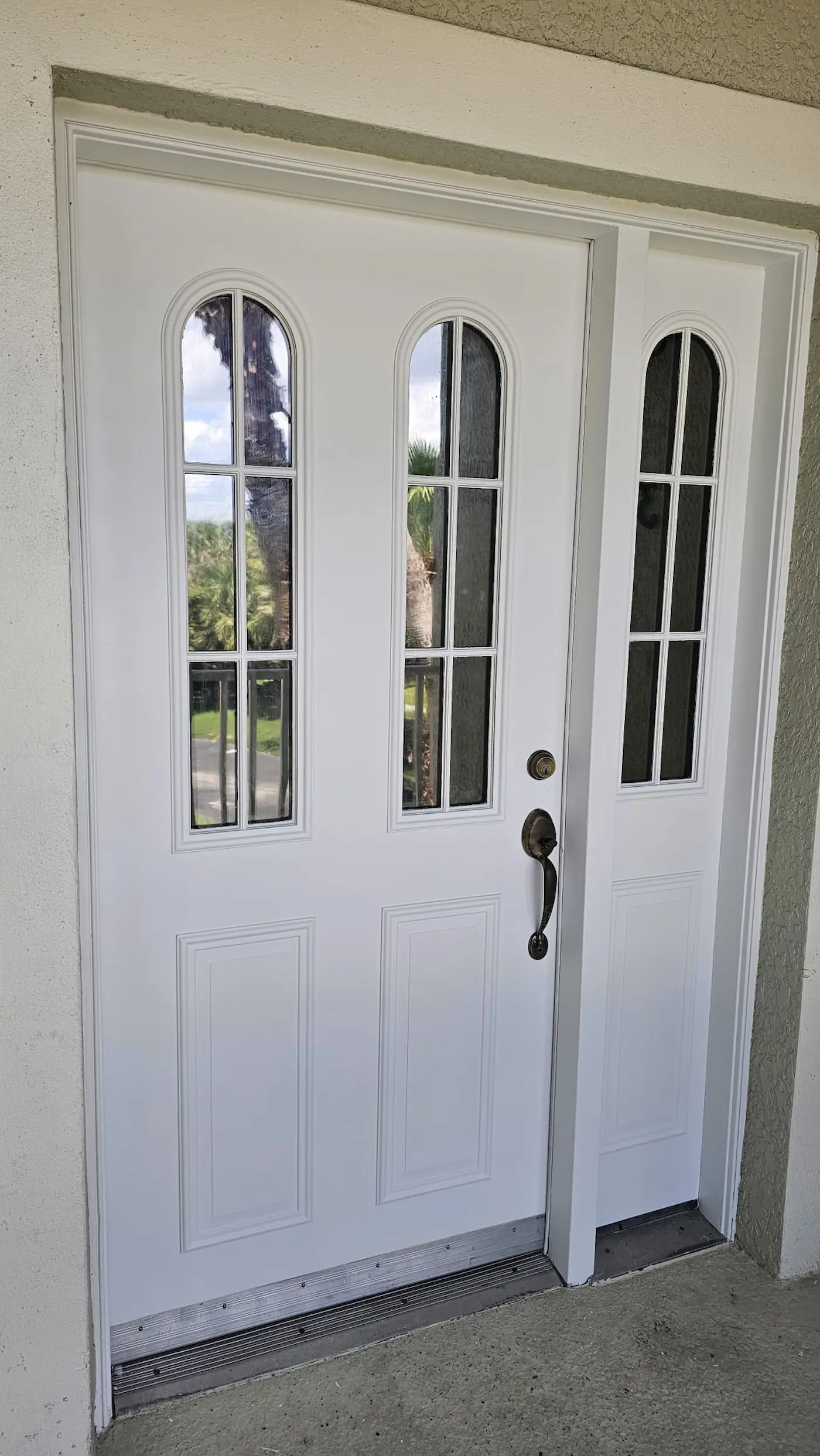 Freshly painted exterior front door with a clean, durable finish in Sarasota, Florida.
