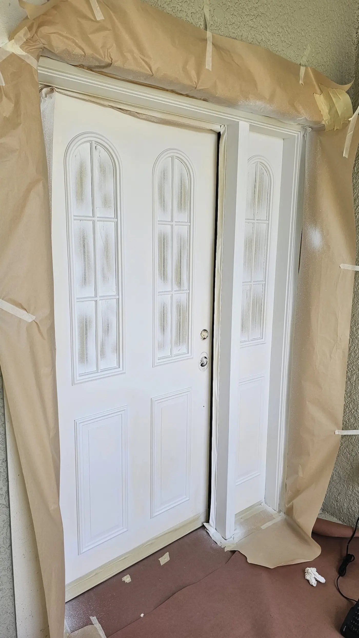 Exterior front door primed and ready for the final coat of paint in Sarasota, Florida.