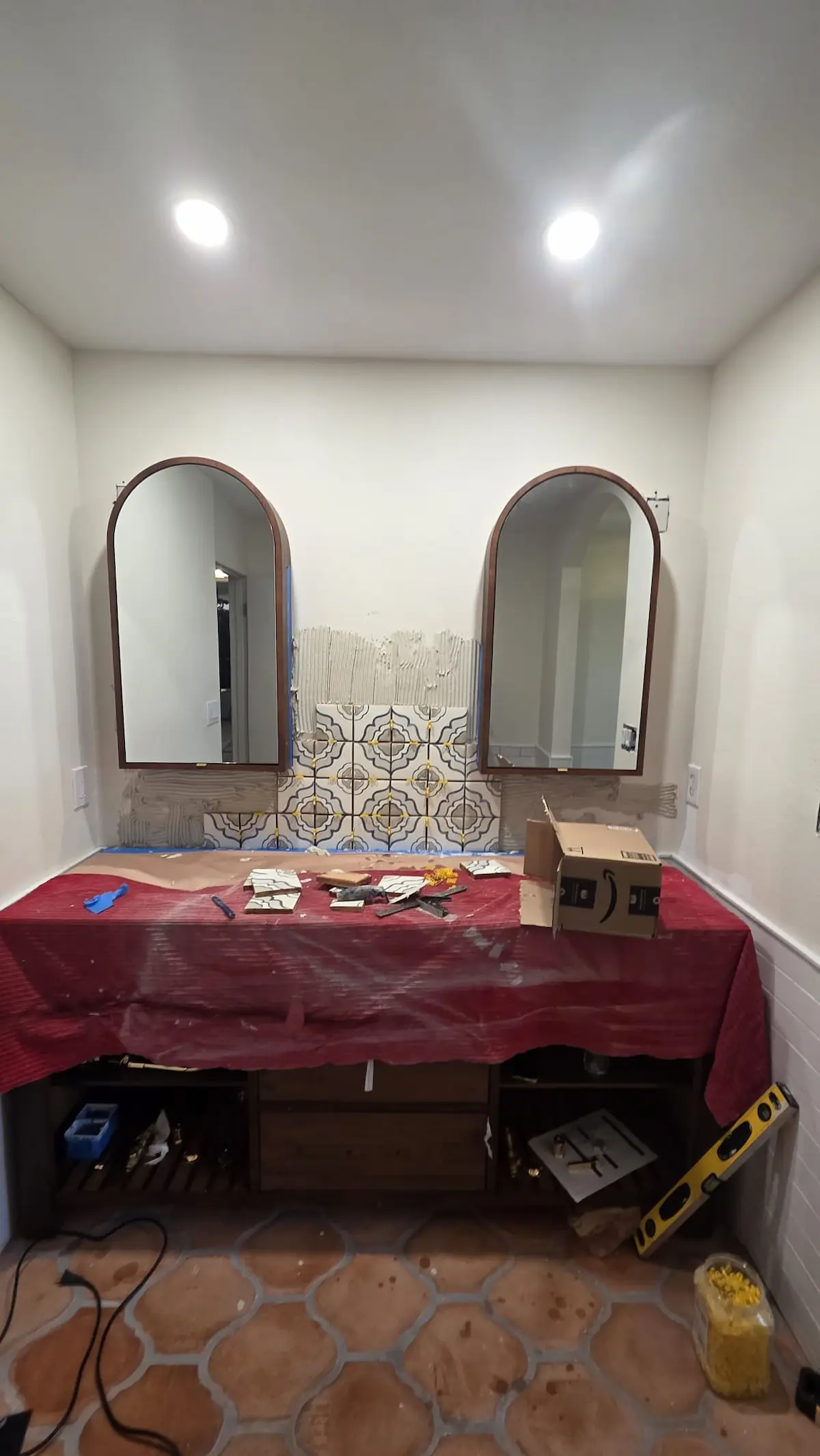 Bathroom tile installation in progress